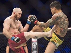 Diego Ferreira, right, fights Kyle (The Monster) Nelson, left,  in Toronto on Saturday, Dec. 8, 2018.