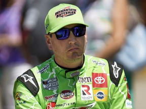 FILE - Kyle Busch watches during NASCAR Cup Series auto race qualifying at the Michigan International Speedway in Brooklyn, Mich., on Aug. 6, 2022. Busch, who was detained at a Mexican airport last month when a handgun was discovered in his luggage, was sentenced to 3½ years in prison and a $1,000 fine for having a gun and ammunition earlier this month by a judge in the Mexican state of Quintana Roo, home to beach destinations Cancun and Tulum. The federal Attorney General's Office said that the judge decided to allow a conditional punishment and let Busch leave Mexico after he paid a bond. The office did not say how much he paid.