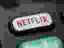 This Aug. 13, 2020 file photo shows a logo for Netflix on a remote control in Portland, Ore.