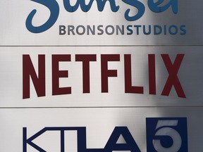 A Netflix sign is photographed outside its office building in Los Angeles, April 20, 2022. Netflix is cutting its prices in several of its smaller markets, Friday, Feb. 24, 2023, in the latest twist on the video streaming service's efforts to keep its recently revived subscriber growth rolling amid stiffer competition and inflation pressures.