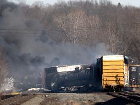 Smoke rises from a derailed cargo train in East Palestine, Ohio, Saturday, Feb. 4, 2023.