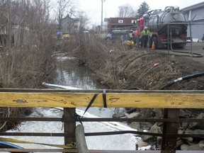 Crews run operations to clean and test the Sulphur Run creek in East Palestine, Feb. 16.