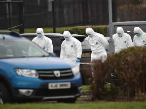 Police examine the scene of the shooting of a high profile PSNI officer at the Youth Sports Centre on February 23, 2023 in Omagh, Northern Ireland.