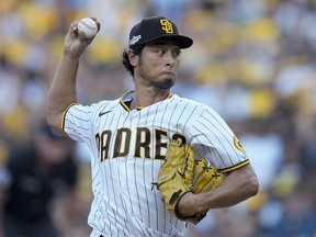 San Diego Padres starting pitcher Yu Darvish throws against the Philadelphia Phillies during the first inning in Game 1 of the baseball NL Championship Series between the San Diego Padres and the Philadelphia Phillies, Oct. 18, 2022, in San Diego.