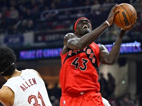 Raptors forward Pascal Siakam (right) drives to the basket beside Cleveland Cavaliers' Jarrett Allen in the first quarter at Rocket Mortgage FieldHouse on Sunday, Feb. 26, 2023.