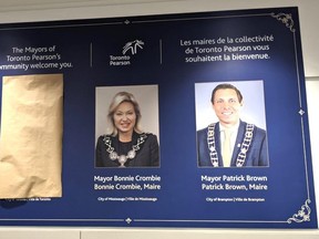 Former Toronto mayor John Tory's photo on the Mayors of Toronto's Pearson community welcome you sign at Pearson airport was recently spotted covered by brown paper.