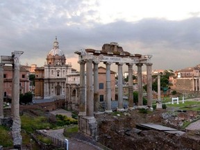 The ruins of ancient Rome including the Forum, far right, the Coliseum and  the Arch of Constantine are pictured.