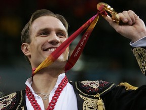 Roman Kostomarov of Russia is seen with his gold medal at the Turin 2006 Winter Olympic Games on February 20, 2006 at Palavela in Turin, Italy.