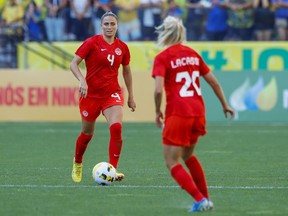 Canada's Shelina Zadorsky, left, controls the ball near teammate Cloe Lacasse during a women's friendly soccer match against Brazil at Neo Quimica Arena in Sao Paulo, Brazil, Tuesday, Nov. 15, 2022. The job action by the Canadian women's soccer team has already produced results.