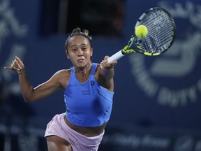 Canada's Leylah Annie Fernandez returns the ball to Poland's Iga Swiatek during a match of the Dubai Duty Free Tennis Championships in Dubai, United Arab Emirates, Tuesday, Feb 21, 2023. Leylah Fernandez of Laval, Quebec and her American playing partner Bethany Mattek-Sands lost 7-5, 7-5 to Russians Veronika Kudermetova and Liudmila Samsonova in the quarterfinals of the Dubai Tennis Championship on Thursday.