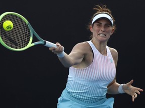 Rebecca Marino of Canada plays a forehand return to Zhu Lin of China during their first round match at the Australian Open tennis championship in Melbourne, Australia, Monday, Jan. 16, 2023. Marino fell 7-6 (5), 6-2 to Russia's Daria Kasatkina in the opening round of the Qatar Open on Tuesday.