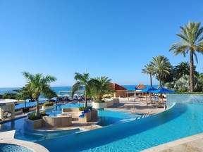 One of the pools at Divi Little Bay Beach Resort, with the stunning Caribbean in the background.