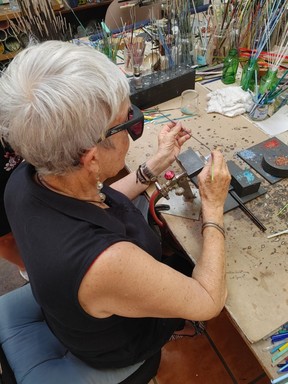 Glass artist JoBean Chambers shows off her skill at her shop in Windwardside.
