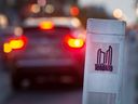 A vehicle brakes with a City of Toronto sign on Bloor St. in Toronto on Oct. 25, 2022.