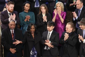 From left to right: Rodney Wells and RowVaughn Wells, parents of Tyre Nichols, are applauded by Brandon Tsay, hero of the Monterey, California, shooting, Irish singer-songwriter Bono and Paul Pelosi, husband of Rep. Nancy Pelosi (D-CA), during U.S. President Joe Biden’s State of the Union address in the House Chambers of the U.S. Capitol on Feb. 7, 2023 in Washington, D.C.