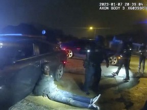 In this image from video released on Jan. 27, 2023, by the city of Memphis, Tenn., Tyre Nichols leans against a car after a brutal attack by five Memphis Police officers on Jan. 7, in Memphis.
