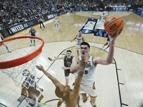 Zach Edey of the Purdue Boilermakers shoots against the Fairleigh Dickinson Knights during the second half in the first round of the NCAA Men's Basketball Tournament.