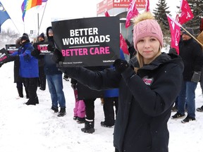 Ontario Nurses Association members and supporters take part in an information picket on Paris St. near an entrance to Health Sciences North in Sudbury, Ont. on Thursday, February 23, 2023. John Lappa/Postmedia Network
