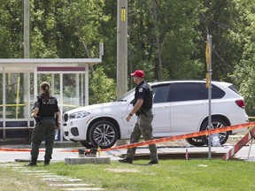 A pair of Laval police officers survey the scene after Rocco Sollecito was killed in 2016.