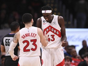 Toronto Raptors forward Pascal Siakam celebrates with guard Fred VanVleet after scoring during overtime against the Washington Wizards.