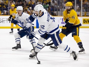Zach Aston-Reese of the Toronto Maple Leafs takes a slapshot against the Nashville Predators during the second period at Bridgestone Arena on March 26, 2023 in Nashville, Tennessee.