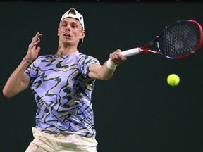Denis Shapovalov of Canada hits a forehand in his straight set loss to Ugo Humbert of France during the BNP Parisbas at the Indian Wells Tennis Garden on March 10, 2023 in Indian Wells, California.