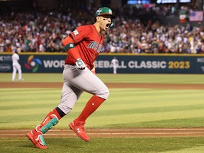 Joey Meneses #32 of Team Mexico celebrates after hitting a three-run home run against Team USA during the fourth inning of the World Baseball Classic Pool C game at Chase Field on March 12, 2023 in Phoenix, Arizona. Team Mexico defeated Team USA 11-5.