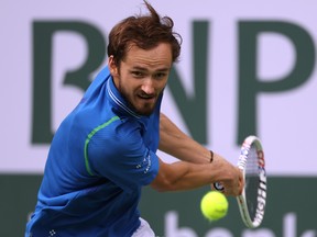 Daniil Medvedev of Russia plays a backhand in his three set win over Alexander Zverev of Germany during the BNP Paribas Open at the Indian Wells Tennis Garden on March 14, 2023 in Indian Wells, California. (Photo by Harry How/Getty Images)