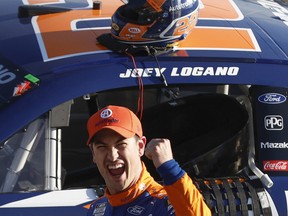Joey Logano, driver of the No. 22 Autotrader Ford, celebrates after winning the NASCAR Cup Series Ambetter Health 400 at Atlanta Motor Speedway on March 19, 2023 in Hampton, Ga.