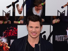 Television personality Nick Lachey arrives on the red carpet for the 2014 MTV Movie Awards at the Nokia Theater in Los Angeles, Calif., on April 13, 2014.