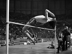 Mission, B.C. high jumper Debbie Brill, the first North American woman to clear six feet, and a medalist at the 1970 Commonwealth Games, soars over the bar at a Pacific Coliseum track meet. February 20, 1971.