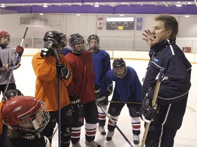 Dave Gardner, a former NHLer, offers instruction to players from the Mount Carmel Crusaders. The defending Ontario champions are once again top contenders for this high school hockey season.
