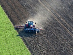 In this file photo taken on March 25, 2017, a tractor sows seeds in a cereal crop, near Laon, northeastern France.