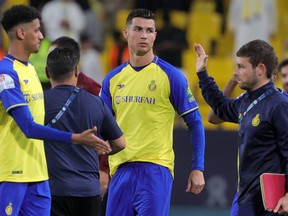 Nassr's Portuguese forward Cristiano Ronaldo (C) looks on after the King Cup quarter-final football match between al-Nassr and Abha at Mrsool Park Stadium in Riyadh on March 14, 2023. (Photo by Fayez NURELDINE / AFP) (Photo by FAYEZ NURELDINE/AFP via Getty Images)