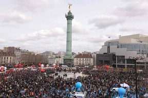 Protester gather in place de la Bastille square during a demonstration, a week after the government pushed a pensions reform through parliament without a vote, using the article 49.3 of the constitution, in Paris on March 23, 2023.