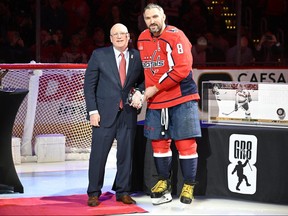 Washington Capitals left wing Alex Ovechkin and deputy NHL commissioner Bill Daly during a ceremony to honor scoring an NHL second best 802 career goal before the game against the Columbus Blue Jackets at Capital One Arena in Washington, D.C., March 21, 2023.
