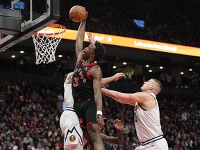 Toronto Raptors forward O.G. Anunoby (3) dunks a ball against Denver Nuggets center Nikola Jokic (15) during the first half at Scotiabank Arena. John E. Sokolowski-USA TODAY Sports