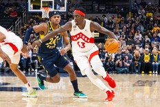 Jan 2, 2023; Indianapolis, Indiana, USA; Toronto Raptors forward Pascal Siakam (43) dribbles the ball while Indiana Pacers guard Buddy Hield (24) defends in the second half at Gainbridge Fieldhouse.