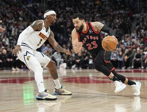 Toronto Raptors guard Fred VanVleet (23) dribbles the basketball against Denver Nuggets guard Kentavious Caldwell-Pope (5) during the first half at Scotiabank Arena March 14, 2023.