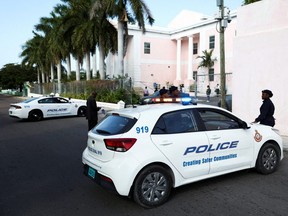 Police block the road in front of the Magistrate Court building in Nassau, Bahamas, Dec. 13, 2022.