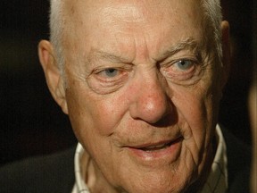 Former Winnipeg Blue Bombers head coach and CFL Hall of Fame member Bud Grant smiles during an interview in this file photo.