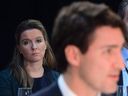 Chief of staff Katie Telford, left, looks on as Prime Minister Justin Trudeau delivers his opening remarks during the Meeting of First Ministers in Ottawa on December 9, 2016.  