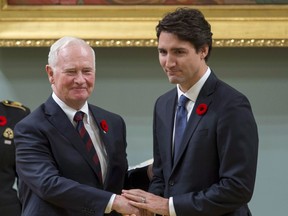 Prime Minister Justin Trudeau shakes hands with Governor General David Johnston after being sworn in as prime minister of Canada at Rideau Hall in Ottawa on Wednesday, Nov. 4, 2015.