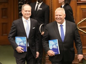 Ontario Finance Minister Peter Bethlenfalvy (left) and Premier Doug Ford arrive to table the provincial budget at the legislature at Queen's Park in Toronto on Thursday, March 23, 2023.