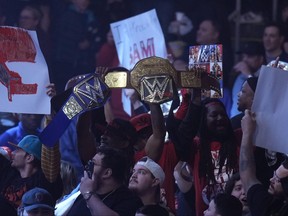 Wrestling fans cheer during the WWE Monday Night RAW event, Monday, March 6, 2023, in Boston.  WWE’s WrestleMania arrives this weekend, Saturday, April 1, to a massive audience and vastly larger advertising revenue as it seeks to establish itself as a serious contender for major advertising bucks.