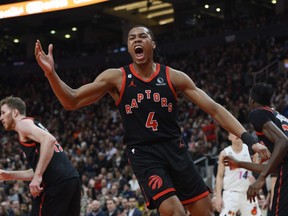 Raptors forward Scottie Barnes (4) reacts after scoring during first half NBA basketball action against the Miami Heat.