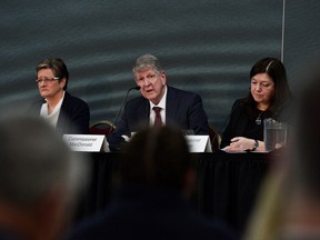 Commission chair Michael MacDonald, Commissioners Leanne Fitch and Kim Stanton address family, friends and the public as the Mass Casualty Commission delivers its final report into the April 2020 mass shootings, when a gunman who at one point masqueraded as a police officer caused country's worst mass shooting during a 12-hour rampage, in Truro, Nova Scotia, Canada, on March 30, 2023.