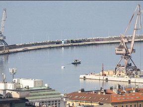 A police boat tows buoys containing a secured 150 kilograms of naval mine from the Second World War from the port of Rijeka, Croatia, March 19, 2023.