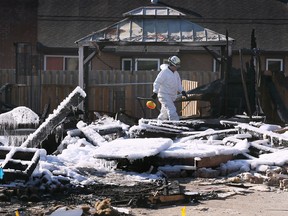 An investigator works the scene of a house explosion on Aspen Lane in Windsor Monday, March 20 2023.