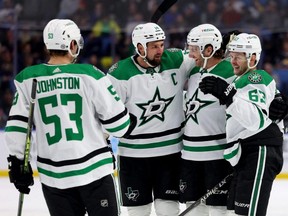 Stars right wing Evgenii Dadonov (right) celebrates his goal with teammates during the third period against the Buffalo Sabres at KeyBank Center in Buffalo, N.Y., Thursday, March 9, 2023.